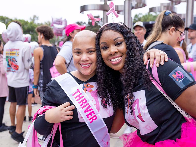 two black women at a breast cancer event